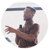 image of yound black man speaking to a crowd with a microphone | The Gulf Coast Sexual Assault Program provides services to victims of sexual violence in Bay, Gulf, Calhoun, Jackson, Washington, Santa Rosa, Escambia, Okaloosa, Walton and Holmes Counties